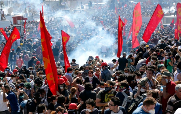 Riot police use tear gas to disperse demonstrators during an anti-government protest at Taksim square in central Istanbul